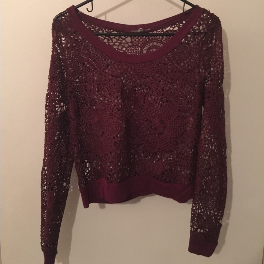 A maroon see-through long sleeve shirt
